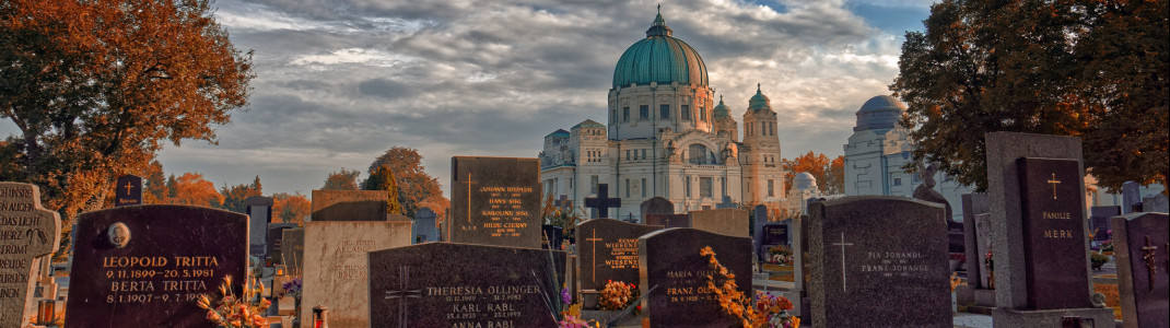 View of Graves at Vienna Central Cemetery and the Charles Borromeo Church in the background.