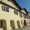 The saline houses with their red window shutters are located at Karl-Theodor square in Traunstein.