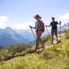 The trail winds gently downhill along the sunny slopes of the Penken.