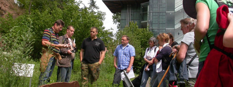 During a group tour, staff explain the special features of the regional natural area.