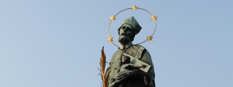 The bridge is lined with figures of saints.
