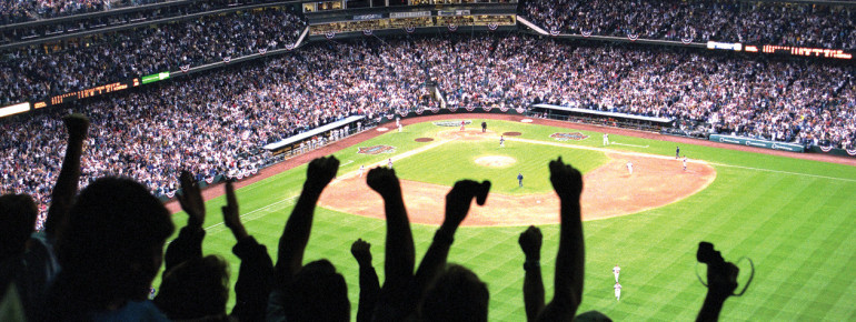 Fans of the Colorado Rockies cheer on their local baseball team at Coors Field.