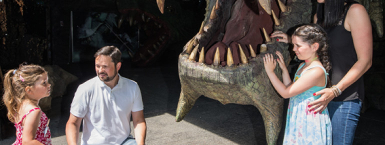 In the dragon cave, young and old can get up close to the legendary beast.