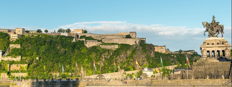 From the banks of the Rhine, one can gaze upon the mighty Ehrenbreitstein Fortress.