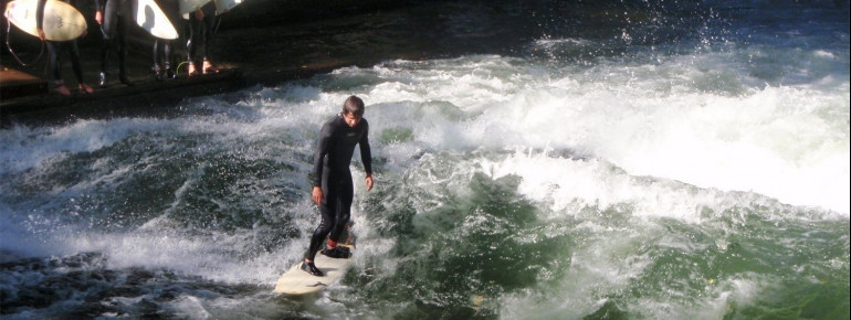 There are usually several surfers at the riverside, waiting their turn.