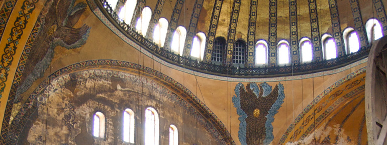 The interior is decorated with religious mosaics.