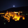 Heidelberg Castle is illuminated at night.