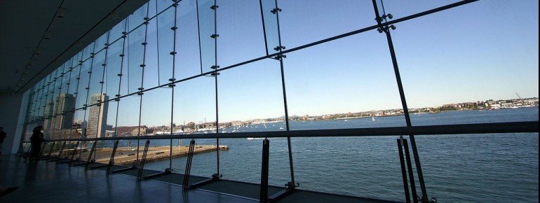 A view on the sea through the glass front of the museum