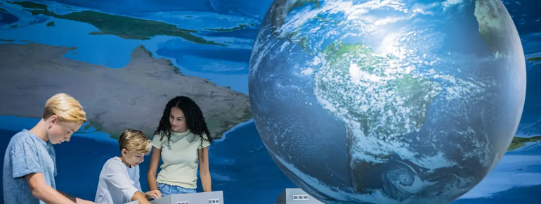 In the KLIMA ARENA, visitors use the globe to discover how climate change is affecting the world.