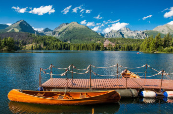 Enjoy the picturesque mountain panorama from a little boat.