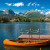 Enjoy the picturesque mountain panorama from a little boat.