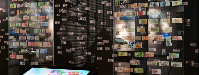 The exhibition is divided into four thematic areas: "Cash", "Book Money", "Monetary Policy", and "Global Money".