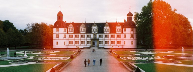 Neuhaus Castle and the Castle & Riverside Park combine historic architecture, blooming gardens, and diverse recreational activities into a truly unique experience.