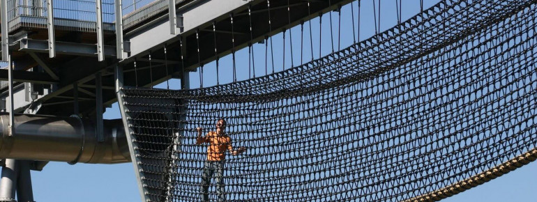 Like Indiana Jones, you can walk across the Jungle Bridge at dizzying heights.