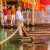 Little pirates bravely pull themselves across the pirate lake on a raft.