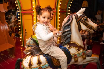 The colorful carousel guarantees fun-filled rides for the little ones.