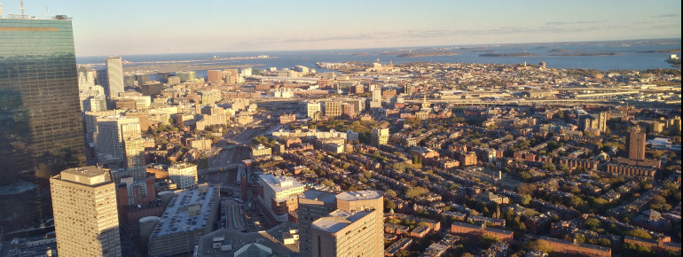 Just below the horizon you can catch a glimpse at Boston's Logan International Airport.