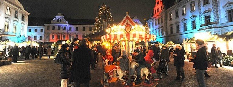 Children enjoy a ride on the carousel.
