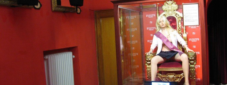 A lifelike rubber doll welcomes visitors at the entrance hall.