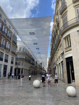 In summer, large awnings provide shade and protect pedestrians from the intense heat.