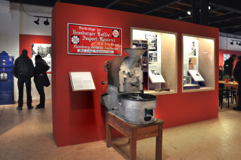 An old coffee roaster on display.