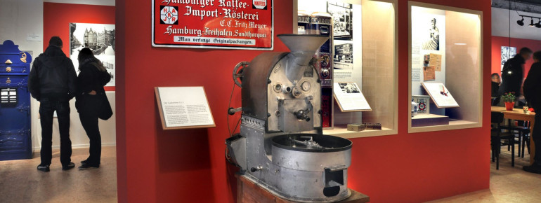 An old coffee roaster on display.