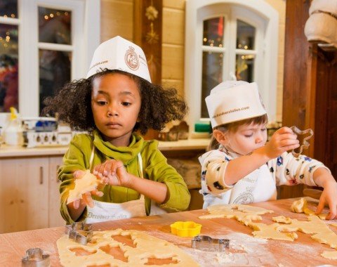 Children get to bake chirstmas cookies.