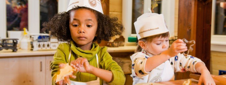Children get to bake chirstmas cookies.