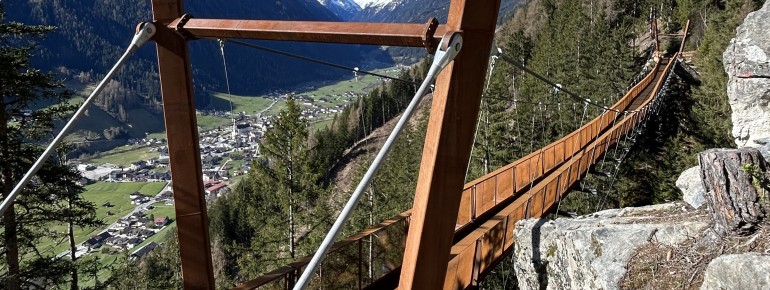 The view from the suspension bridge on the Sunnenseit'n Weg over the Stubai Valley