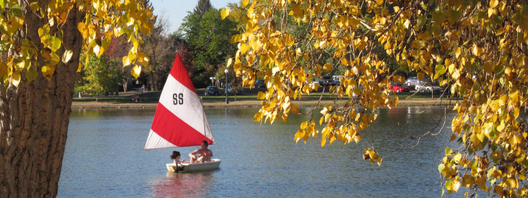 Pick one of tons of activities: Couple in a boat during fall at Washington Park.