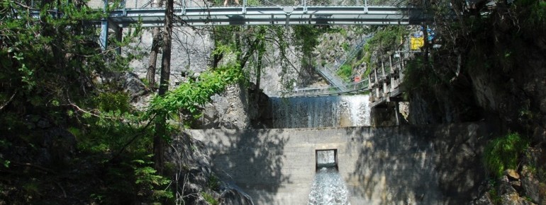 Above the waterfall, the stone bull's head and the petrified nymph have guarded the narrowest point of the gorge for centuries.