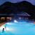 The outdoor pool by night at Premia Spa