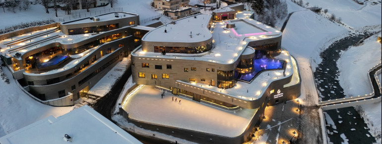 An ice skating rink runs around the spa in winter.
