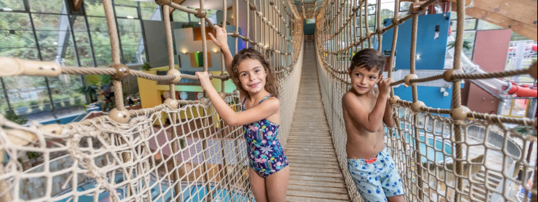 The suspension bridge crosses the adventure pool.