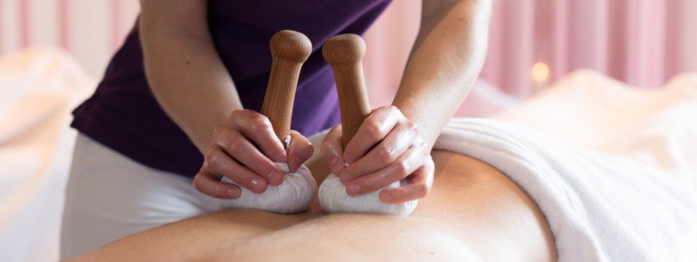 Relax during a Relax herbal stamp massage
