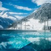 A highlight during the cold season: the year-round heated outdoor pool with a view of the wintery mountain landscape.