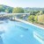 Im ganzjährig beheizten Infinity Pool verschmilzt das 35 °C warme Thermalwasser mit der südburgenländischen Landschaft.