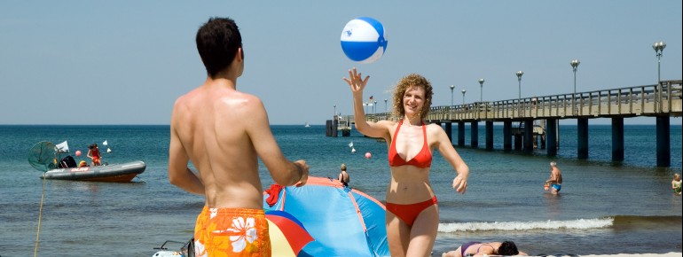 The sandy beach offers enough space to play ball.