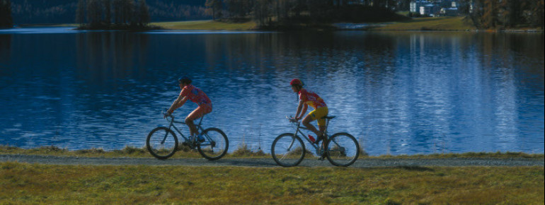 Biking or hiking with Alpine backdrop - another great activity at Lake Silvaplana.